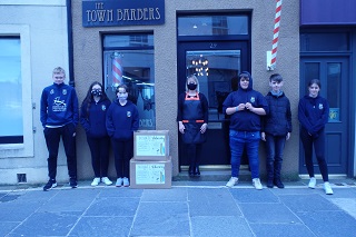 KGS pupils outside The Town Barbers.